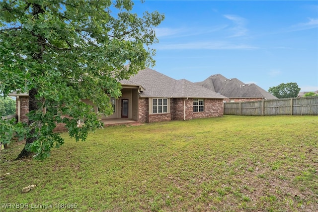 2117 Parkway Cir, Van Buren, AR 72956 - view of front facade with brick siding, a patio, and a shingled roof