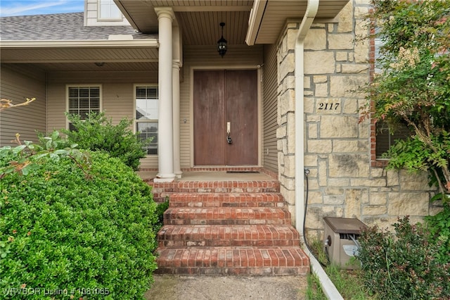 2117 Parkway Cir, Van Buren, AR 72956 - property entrance featuring stone siding and roof with shingles