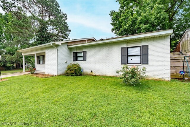1501 M Cir, Barling, AR 72923 - view of front of house with brick siding and a front lawn