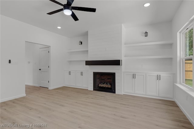 9009 Carson Way, Fort Smith, AR 72908 - unfurnished living room featuring a ceiling fan, light wood finished floors, a fireplace, plenty of natural light, and recessed lighting