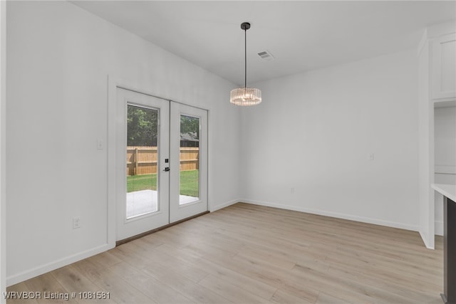 9009 Carson Way, Fort Smith, AR 72908 - unfurnished dining area featuring french doors, light wood-style flooring, a chandelier, and baseboards