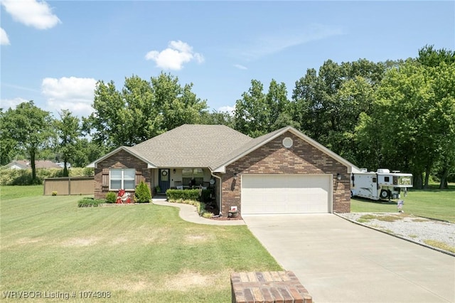 single story home with a front yard and a garage