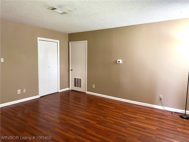 1800 N 45th Ter, Fort Smith, AR 72904 - unfurnished room featuring wood finished floors, baseboards, and a textured ceiling