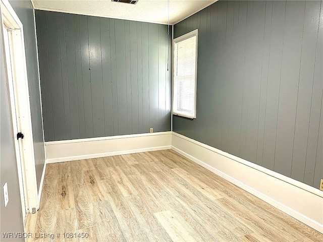1800 N 45th Ter, Fort Smith, AR 72904 - unfurnished room with wood finished floors, wood walls, and baseboards