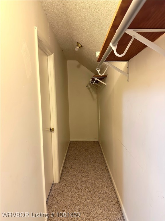 1800 N 45th Ter, Fort Smith, AR 72904 - walk in closet featuring light colored carpet