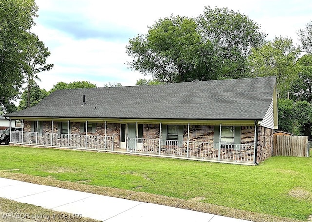 1800 N 45th Ter, Fort Smith, AR 72904 - view of front of home with covered porch, brick siding, and roof with shingles
