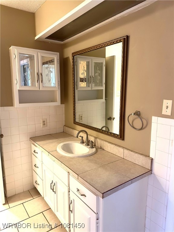 1800 N 45th Ter, Fort Smith, AR 72904 - bathroom with vanity, tile walls, and tile patterned flooring
