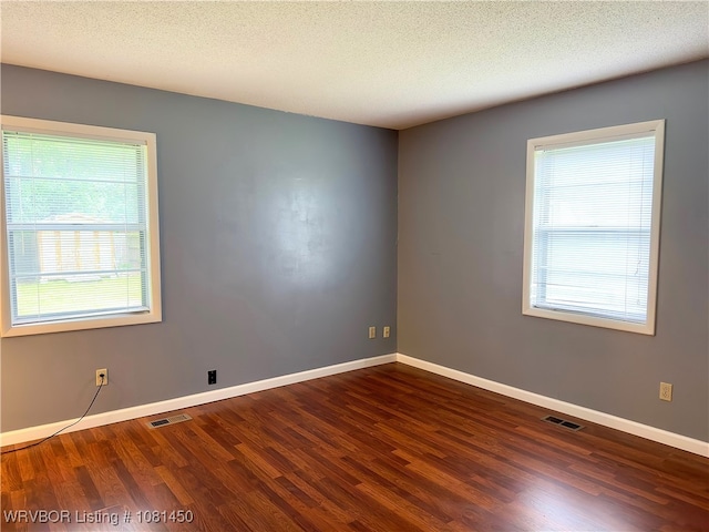 1800 N 45th Ter, Fort Smith, AR 72904 - spare room featuring wood finished floors, baseboards, and a textured ceiling