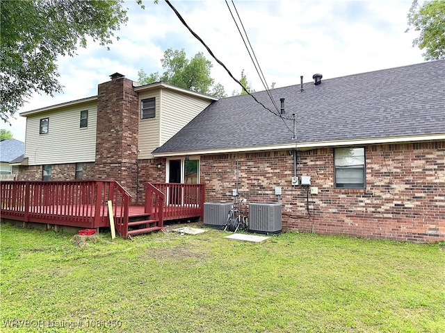 1800 N 45th Ter, Fort Smith, AR 72904 - back of property with central AC unit, roof with shingles, a deck, and a yard
