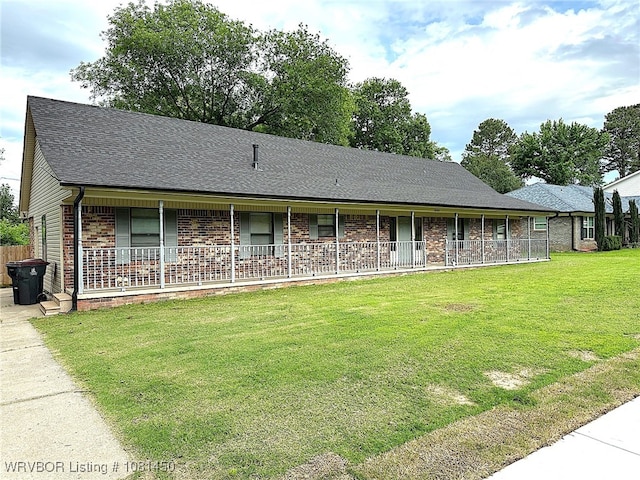 1800 N 45th Ter, Fort Smith, AR 72904 - ranch-style house featuring brick siding, a front yard, a porch, and a shingled roof