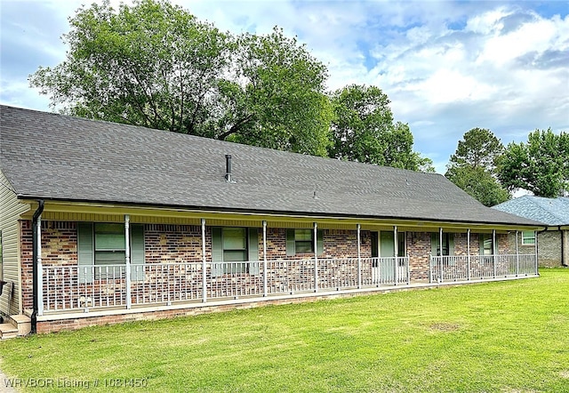 1800 N 45th Ter, Fort Smith, AR 72904 - view of front of home with covered porch, a front lawn, and brick siding
