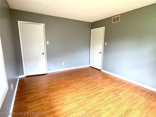 1800 N 45th Ter, Fort Smith, AR 72904 - empty room featuring wood finished floors and baseboards
