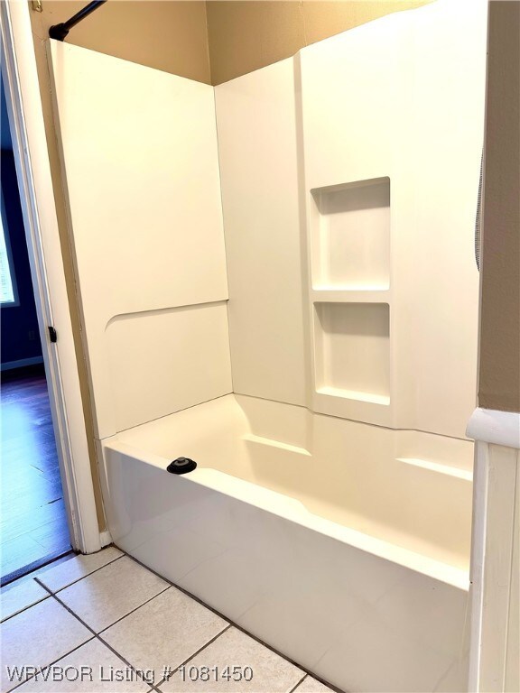 1800 N 45th Ter, Fort Smith, AR 72904 - bathroom with tile patterned floors, a shower, and a bathtub
