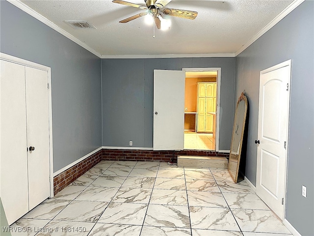 1800 N 45th Ter, Fort Smith, AR 72904 - unfurnished bedroom featuring light marble finish floors, crown molding, a textured ceiling, baseboards, and ceiling fan