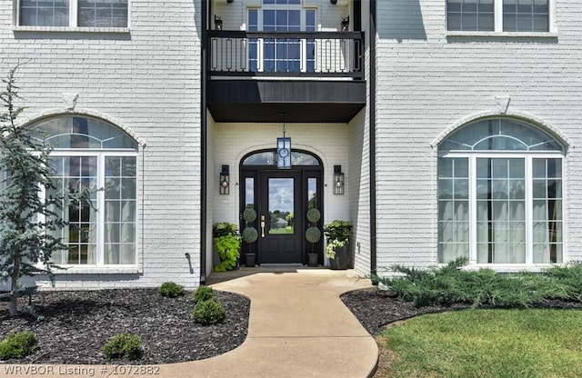 doorway to property featuring a balcony