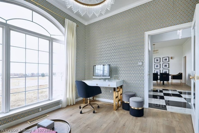 office with crown molding, light wood-type flooring, and a notable chandelier