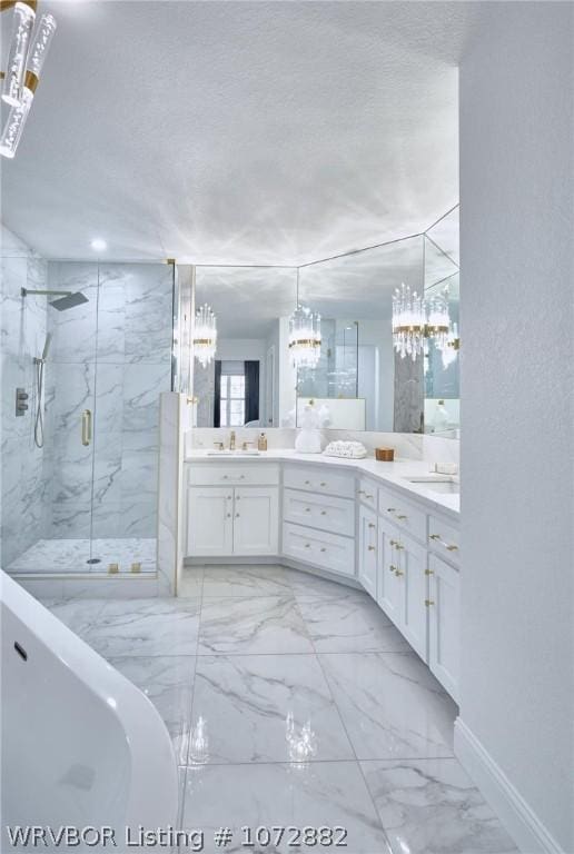 bathroom with vanity and independent shower and bath