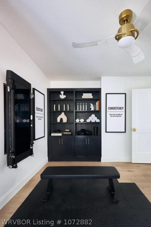 workout room featuring hardwood / wood-style floors