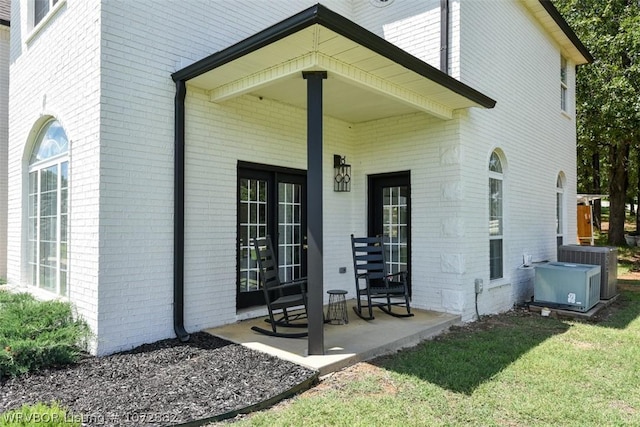 exterior space with cooling unit and a porch