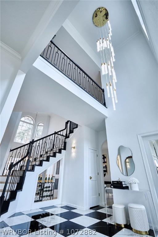 stairway featuring a high ceiling