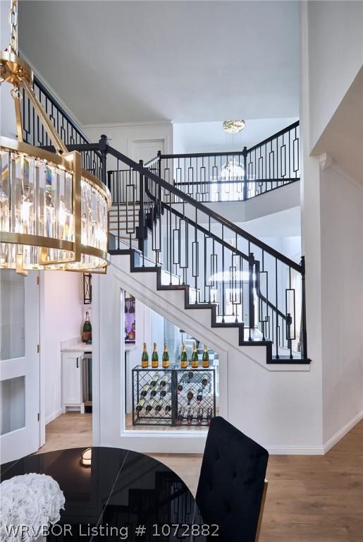 stairs featuring hardwood / wood-style flooring