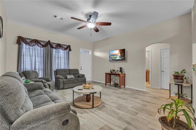 living room with ceiling fan and light wood-type flooring