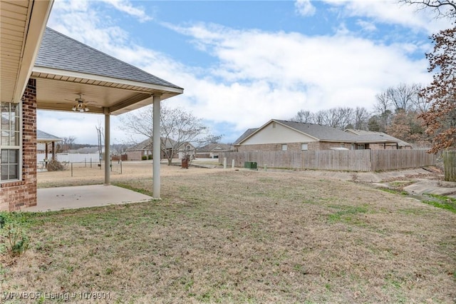 view of yard featuring a patio and ceiling fan