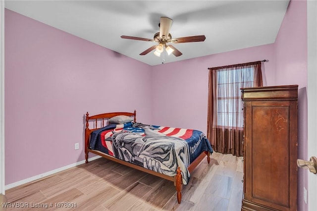 bedroom featuring ceiling fan and light hardwood / wood-style flooring