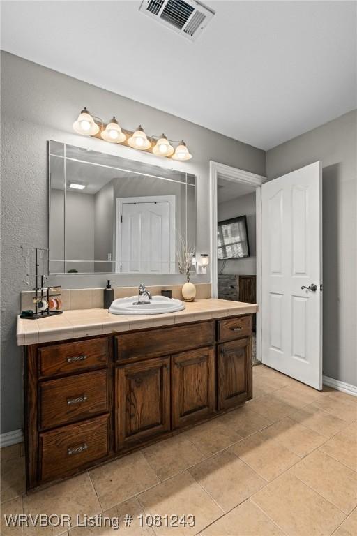 1205 S Division St, Lavaca, AR 72941 - bathroom with vanity and baseboards