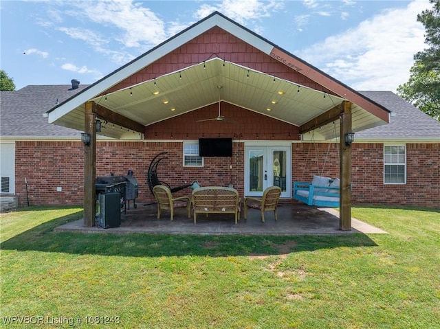 1205 S Division St, Lavaca, AR 72941 - back of property featuring french doors, brick siding, and a yard