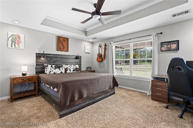 1205 S Division St, Lavaca, AR 72941 - bedroom featuring light colored carpet, crown molding, baseboards, a tray ceiling, and a ceiling fan
