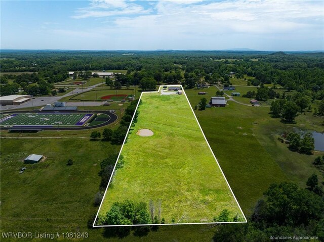 1205 S Division St, Lavaca, AR 72941 - aerial view of property's location featuring property parcel outlined and a forest