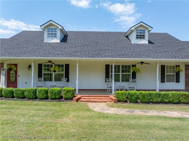 1205 S Division St, Lavaca, AR 72941 - cape cod house with covered porch, a front lawn, a ceiling fan, and roof with shingles