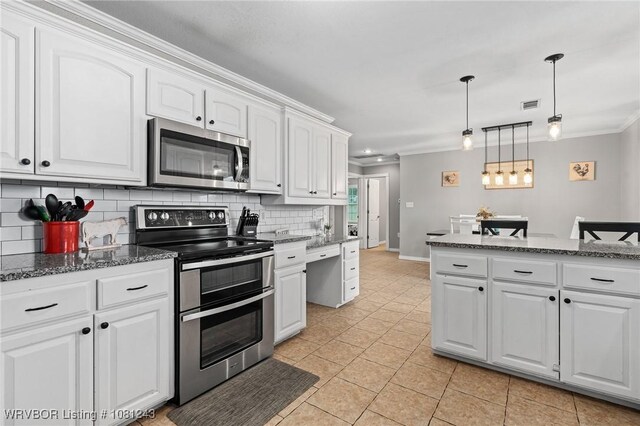 1205 S Division St, Lavaca, AR 72941 - kitchen with appliances with stainless steel finishes, ornamental molding, backsplash, white cabinetry, and decorative light fixtures