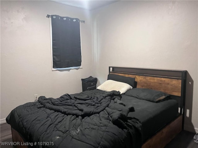 bedroom featuring wood finished floors