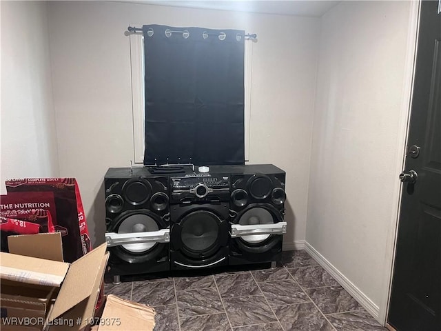 details featuring washer and dryer and baseboards