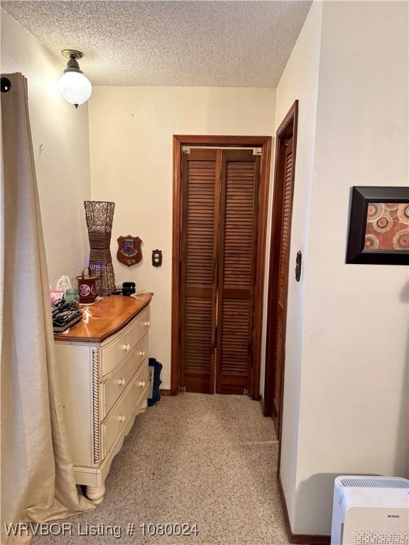 9704 Apple Gate Dr, Fort Smith, AR 72903 - hallway featuring a textured ceiling