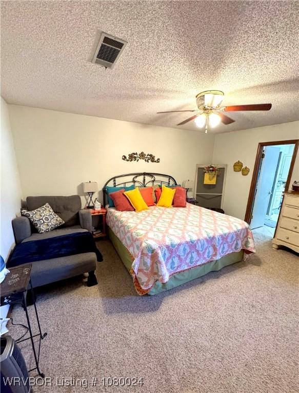 9704 Apple Gate Dr, Fort Smith, AR 72903 - carpeted bedroom with a textured ceiling, ceiling fan, and visible vents