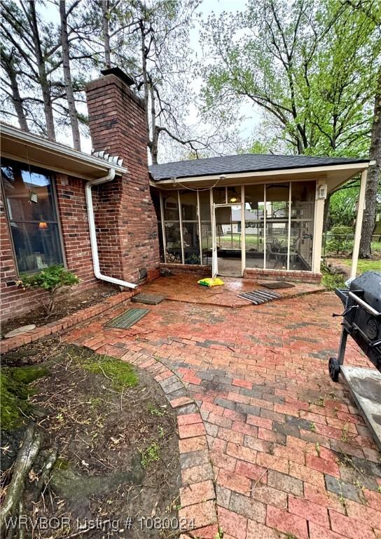 9704 Apple Gate Dr, Fort Smith, AR 72903 - view of patio featuring a sunroom