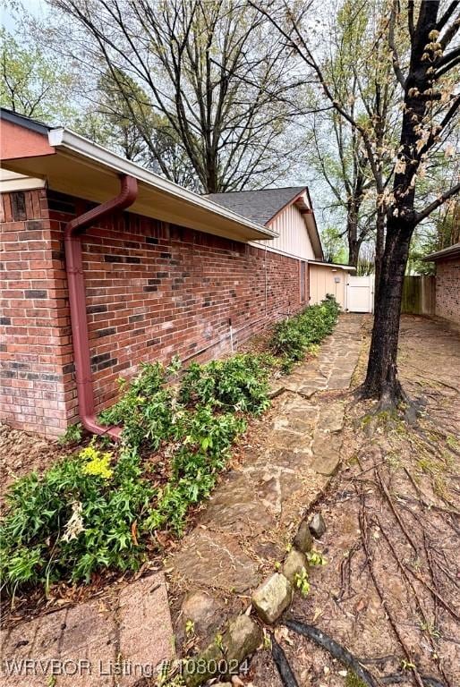 9704 Apple Gate Dr, Fort Smith, AR 72903 - view of home's exterior featuring brick siding and fence