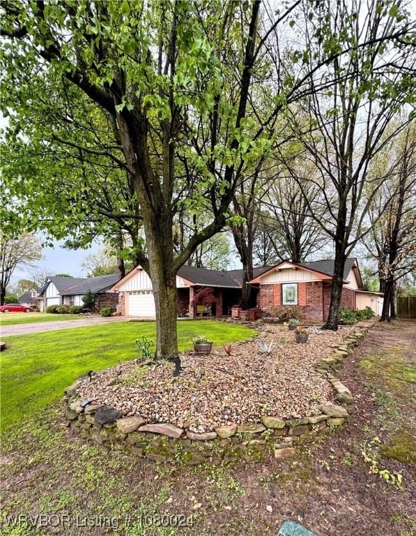 9704 Apple Gate Dr, Fort Smith, AR 72903 - view of front of property with a garage, a front yard, and brick siding
