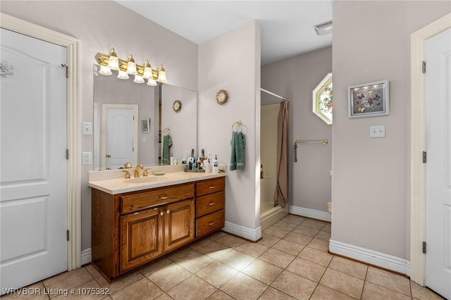 full bathroom with a stall shower, visible vents, vanity, and tile patterned floors