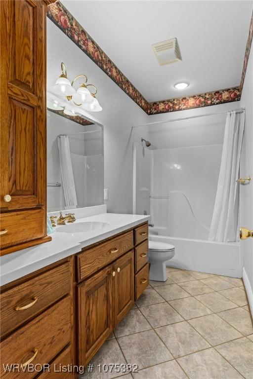 full bath with visible vents, toilet, shower / bathtub combination with curtain, tile patterned flooring, and vanity