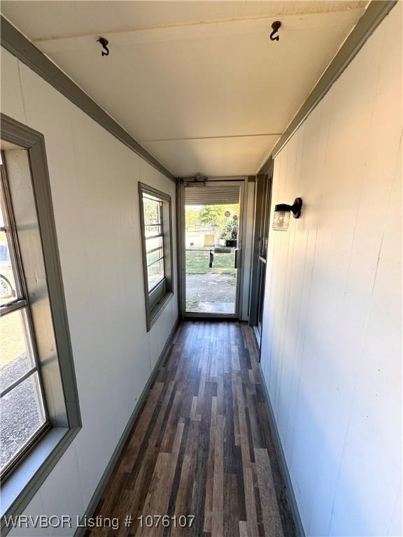 hallway featuring dark hardwood / wood-style flooring