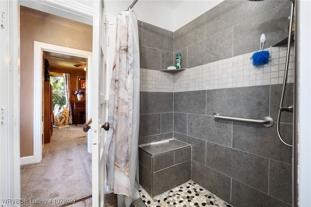 bathroom with tiled shower