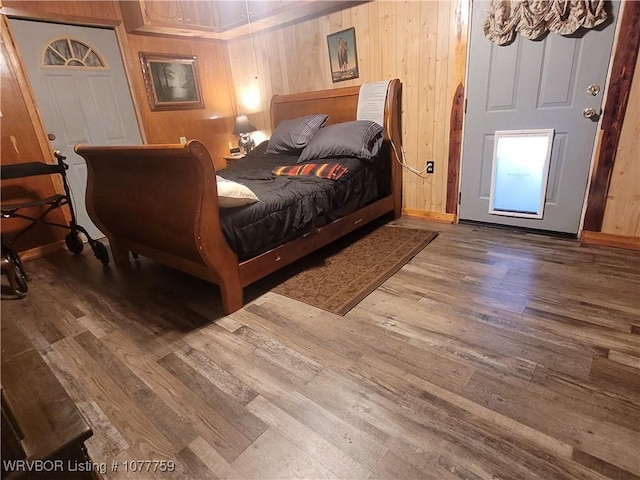 bedroom with hardwood / wood-style flooring