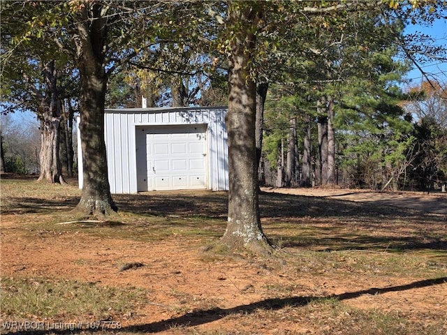 view of outbuilding featuring a garage