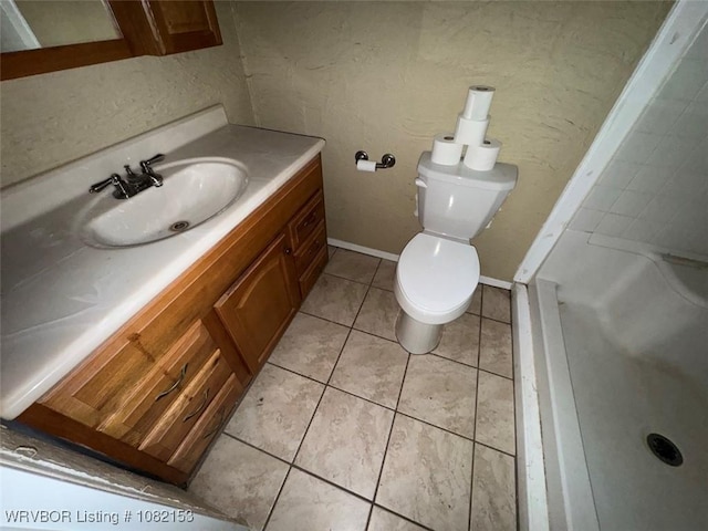 412 7th St, Barling, AR 72923 - full bathroom with vanity, tile patterned floors, and a shower
