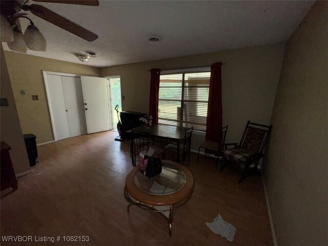 412 7th St, Barling, AR 72923 - living area featuring a ceiling fan and wood finished floors