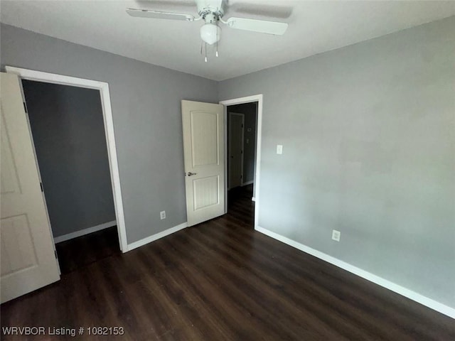 412 7th St, Barling, AR 72923 - unfurnished bedroom with wood finished floors, ceiling fan, and a closet
